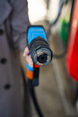 Driver refilling automobile with LPG fuel using gas station nozzle © Rabizo Anatolii