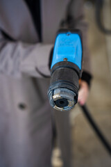 LPG dispenser nozzle inserted into vehicle fuel tank © Rabizo Anatolii