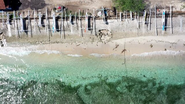 Nusa Penida, Indonesia &ndash; Aerial Top-Down View of Traditional Jukung Boats on Beach