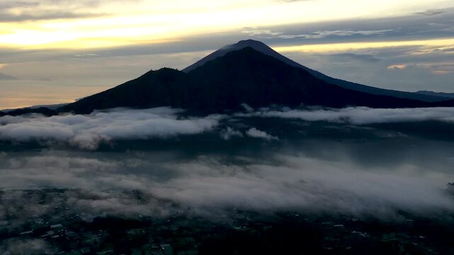 Bali, Indonesia &ndash; Slow Time-Lapse Drone Flying Toward Mount Abang with Cloud Movement Over Lake Batur at Sunrise