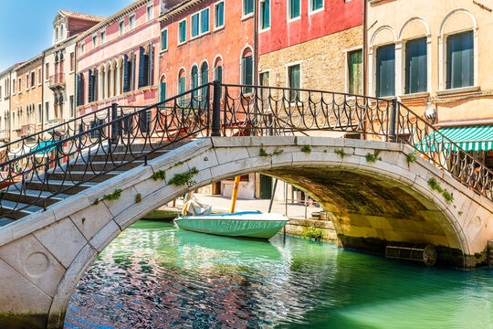 Santa Chiara bridge spans Rio Novo canal, in Murano, Venice, Italy