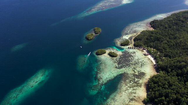 Aerial Rising Drone View from Gam Island Toward Fam Islands, Raja Ampat Indonesia