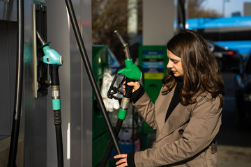Driver filling automobile with gasoline using fuel station nozzle © Rabizo Anatolii