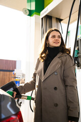Close-up of car tank being filled with fuel nozzle © Rabizo Anatolii