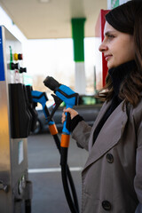 Vehicle refueling using LPG pump nozzle at station © Rabizo Anatolii