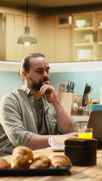 Vertical Video Thoughtful rational man, decision making ideas, pondering and planning the future, modern vision and perspective, concentration and reflection. Considering problem solving, remote work.