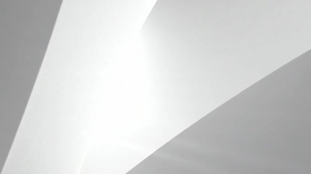 A sleek abstract architecture interior with curved white walls and a bright light source