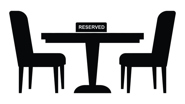 A table and two chairs with a reserved sign