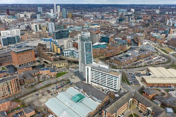 Drone aerial view of Leeds city centre showing Whitehall Waterfront apartments beside the River Aire near Leeds railway station with Wellington Place offices and skyline in the winter time © Duncan