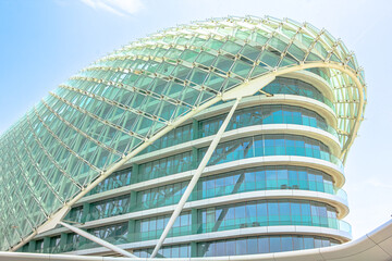 Naklejka premium Abu Dhabi, United Arab Emirates- April 22, 2013: glass architecture of Yas Viceroy on Abu Dhabi's Yas Island. 5-star luxury Resort Hotel is located on Yas Marina Circuit, the racetrack for Formula 1.