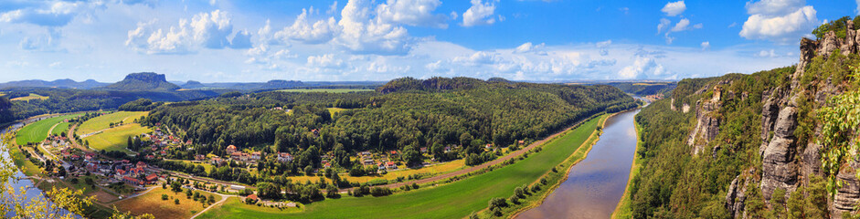 Obraz premium Beautiful landscape, panorama, banner - view of the Elbe valley near the village of Rathen in the Elbe Sandstone Mountains, in Saxony, Germany