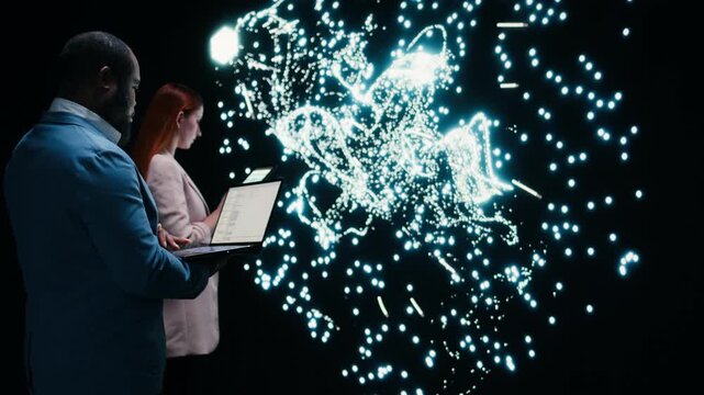 Implementing deep learning algorithms, laptop and data scientist team collaborating in AI startup. Coding, device and coworkers modifying artificial intelligence neural network architecture, camera A