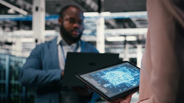 Optimizing AI performance, devices and team of technicians in data center using deep learning. Brainstorming, neural network automation and software developers in data center, camera A