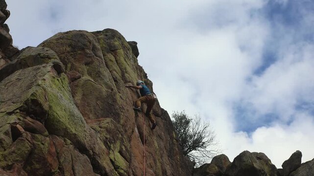 Rock Climber Mastering a Steep Granite Sport Climbing Route