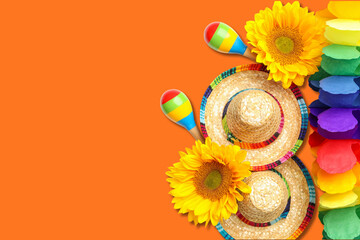 Obraz premium Colorful flowers, hats, and maracas for Cinco de Mayo