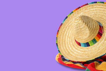 Obraz premium Cinco de Mayo, A sombrero atop a colorful, festive blanket