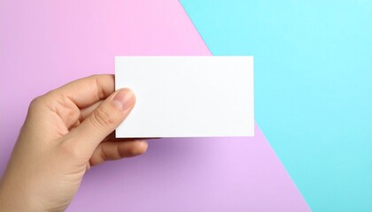 Obraz premium Female hand holding blank white card ready for custom text