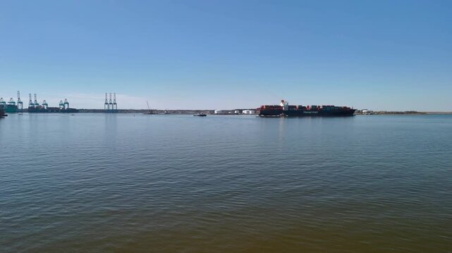 Aerial view of shipping containers and industrial port cranes on the Elizabeth River in Norfolk Virginia waterfront