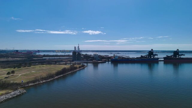 Aerial view of shipping containers and industrial port cranes on the Elizabeth River in Norfolk Virginia waterfront