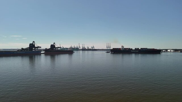 Aerial view of shipping containers and industrial port cranes on the Elizabeth River in Norfolk Virginia waterfront