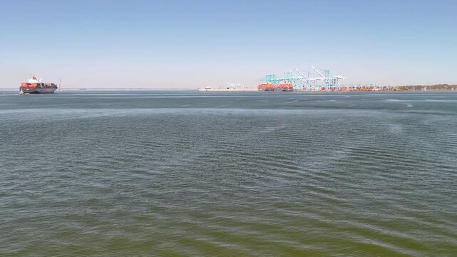Aerial view of shipping containers and industrial port cranes on the Elizabeth River in Norfolk Virginia waterfront