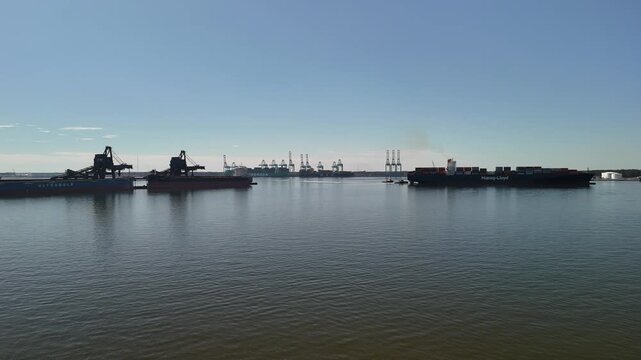 Aerial view of shipping containers and industrial port cranes on the Elizabeth River in Norfolk Virginia waterfront
