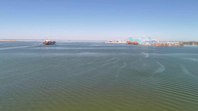 Aerial view of shipping containers and industrial port cranes on the Elizabeth River in Norfolk Virginia waterfront