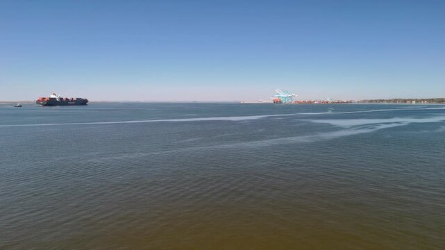 Aerial view of shipping containers and industrial port cranes on the Elizabeth River in Norfolk Virginia waterfront