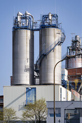 Modern chemical production facility in Wesseling near Cologne. Industrial silos and piping systems for plastics manufacturing. © gehapromo