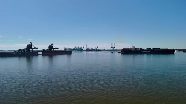 Aerial view of shipping containers and industrial port cranes on the Elizabeth River in Norfolk Virginia waterfront