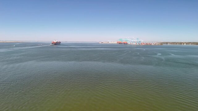 Aerial view of shipping containers and industrial port cranes on the Elizabeth River in Norfolk Virginia waterfront