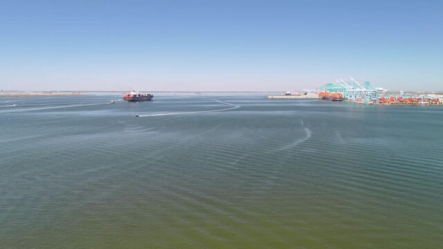 Aerial view of shipping containers and industrial port cranes on the Elizabeth River in Norfolk Virginia waterfront