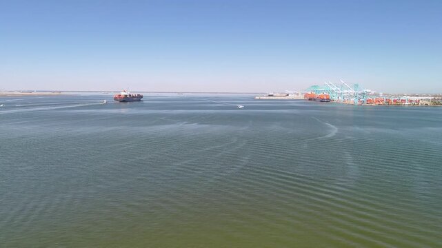 Aerial view of shipping containers and industrial port cranes on the Elizabeth River in Norfolk Virginia waterfront