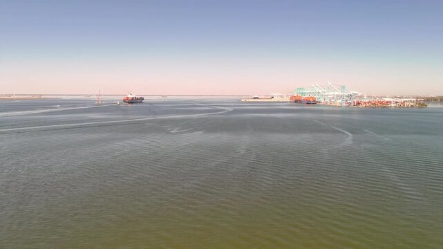 Aerial view of shipping containers and industrial port cranes on the Elizabeth River in Norfolk Virginia waterfront
