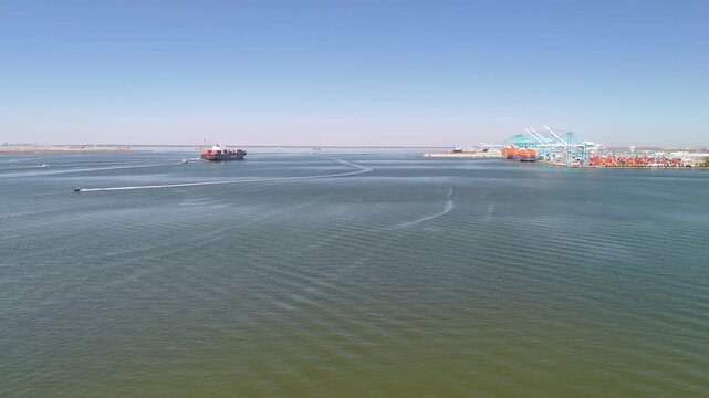 Aerial view of shipping containers and industrial port cranes on the Elizabeth River in Norfolk Virginia waterfront