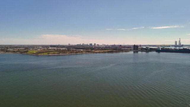Aerial view of shipping containers and industrial port cranes on the Elizabeth River in Norfolk Virginia waterfront
