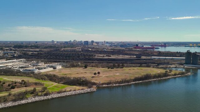 Aerial view of shipping containers and industrial port cranes on the Elizabeth River in Norfolk Virginia waterfront