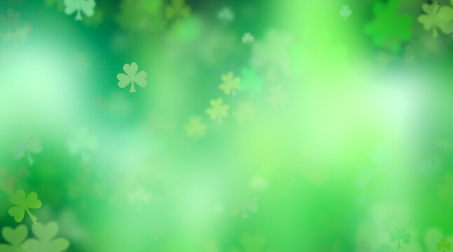St Patrick's Day background with green three leaf clovers. Scattered shamrock or clover shapes in various vibrant greens to celebrate the lucky tradition of St Patricks Day.