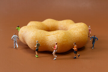 Miniature Joggers Running Around Donut Healthy Lifestyle Concept