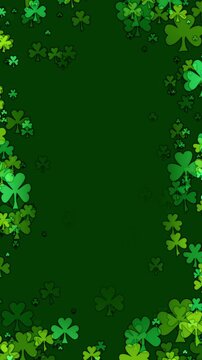 St Patricks day background with a frame of cartoon shamrocks in various greens floating towards center. Clover leaf particles forming a border for a green background to celebrate St Patrick day.