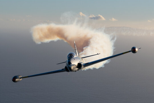 Frontal view of  a T-33 Shooting Star (Cold War  trainer) with smoke on, over South California