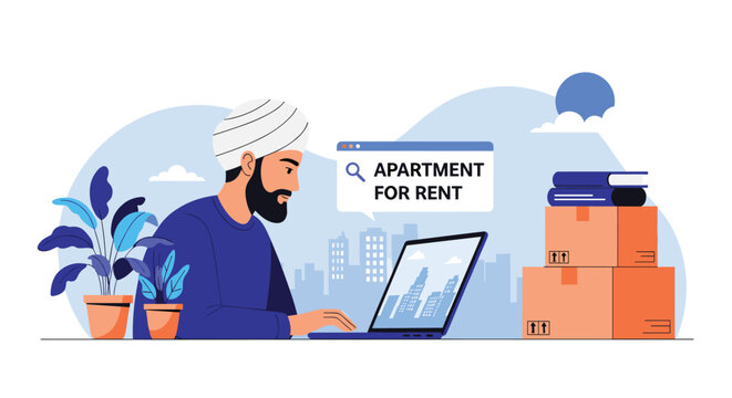 Indian man wearing a white turban uses his laptop at a desk with moving boxes to search for an apartment for rent in a modern city environment.
