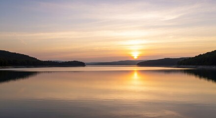 Obraz premium Serene sunset over calm lake with mirrored reflections between two wooded hills