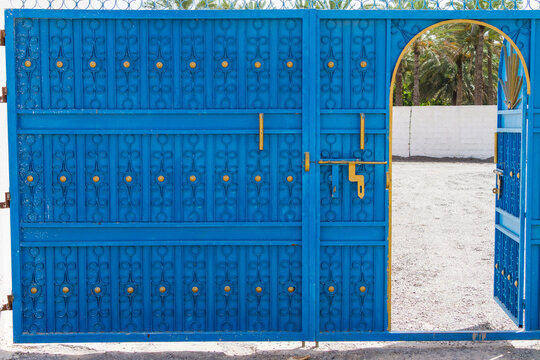 Bright Blue Painted Gate in Omani Village