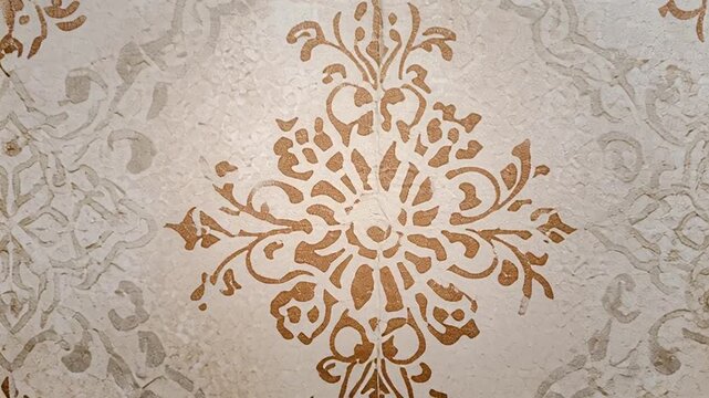 Intricate floral patterns on wallpaper.