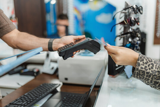 Customer paying for eyewear purchase with credit card
