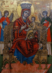 Naklejka premium An old icon representing the Mother of God the Empress with the baby Jesus in her arms, at the Sambata de Sus monastery - Romania