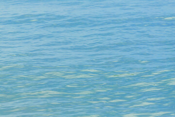 A tranquil blue ocean surface with gentle ripples and subtle sun reflections, ideal as a background or texture for design, marine, travel and relaxation themes. © lms_lms