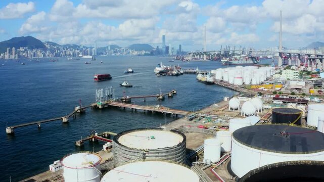Strategic oil storage terminal and city skyline during global energy crisis. Oil transportation and storage tanks 