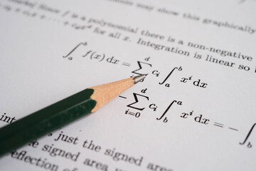 Pencil on mathematic formula exercise test paper in education school.